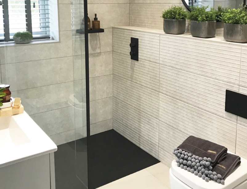 Milano Nero corner wet room shower enclosure with hinged return panel with choice of glass size and drain